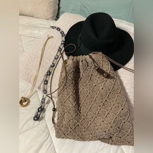 Black hat, tan backpack bag, gold necklace and silver and blue bling belt combo